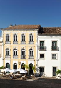 a large building with a large window on top of it at Hotel Villa Bahia in Salvador