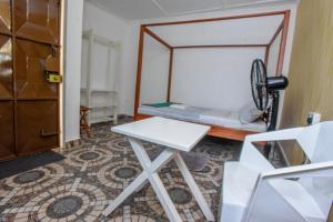 Postel nebo postele na pokoji v ubytování Enkayz Mombasa