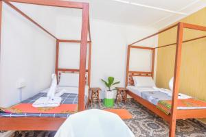 Postel nebo postele na pokoji v ubytování Enkayz Mombasa