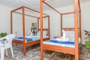 Postel nebo postele na pokoji v ubytování Enkayz Mombasa
