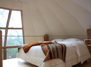 Posteľ alebo postele v izbe v ubytovaní Magma Lodge, Pucon