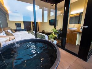 Postel nebo postele na pokoji v ubytování LiVEMAX RESORT Kinugawa