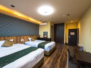 Postel nebo postele na pokoji v ubytování LiVEMAX RESORT Kinugawa