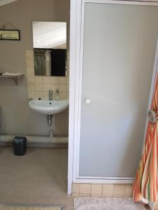 a bathroom with a sink and a mirror at Bethel B&B / Selfcatering in George