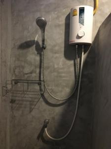 a blow dryer is attached to a wall at Fahad Calm House in Ban Not (1)