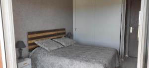 Postel nebo postele na pokoji v ubytování Appartement lumineux vue mer