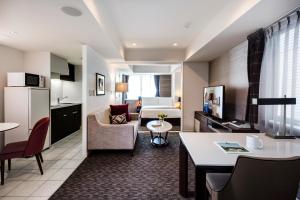 a hotel room with a kitchen and a living room at Somerset Ginza East Tokyo in Tokyo