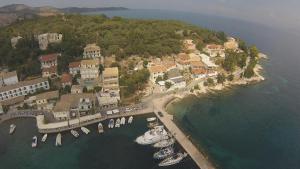 
a large body of water with boats docked in it at Limani Apartments in Kassiopi
