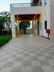 an empty driveway of a house with a garage at Sun Stone Hotel & Club - Jawai in Sheoganj