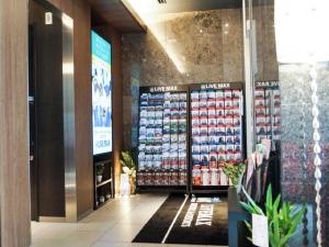 a store aisle with products on display in a store at HOTEL LiVEMAX Saitama-Asaka-Ekimae in Asaka +16 photos