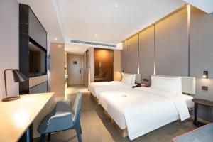 Кровать или кровати в номере Atour Hotel Xian Software Park High-Tech 3rd Road