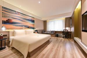 Postel nebo postele na pokoji v ubytování Atour Hotel Dalian Zhuanghe