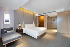 Voodi või voodid majutusasutuse Atour Hotel Xian Software Park High-Tech 3rd Road toas