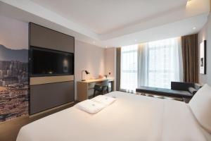 Voodi või voodid majutusasutuse Atour Hotel Xian Software Park High-Tech 3rd Road toas
