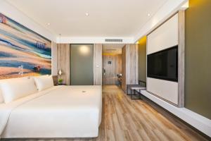 TV a/nebo společenská místnost v ubytování Atour Hotel Dalian Zhuanghe
