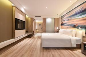 Postel nebo postele na pokoji v ubytování Atour Hotel Dalian Zhuanghe