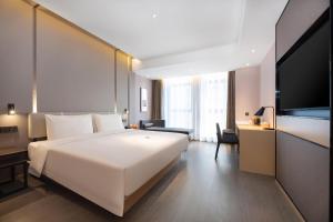 Voodi või voodid majutusasutuse Atour Hotel Xian Software Park High-Tech 3rd Road toas