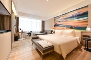 Postel nebo postele na pokoji v ubytování Atour Hotel Dalian Zhuanghe