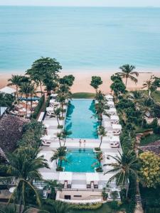 
a beach with palm trees and palm trees at Layana Resort & Spa - SHA Extra Plus in Ko Lanta
