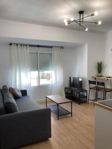a living room with a couch and a table at Castle View Apartments in Alicante