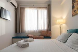 מיטה או מיטות בחדר ב-Apartament Le Bonheur