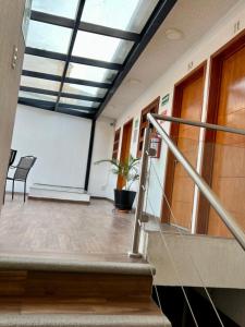 an empty hallway with stairs in a building at Hotel Casa Frida in Cuernavaca