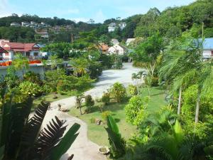 uitzicht op een straat in een stad met huizen bij Phukamala Suite in Kamala Beach