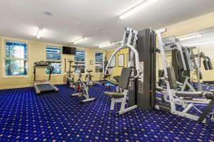 a gym with treadmills and machines in a room at Quality Hotel Canterbury International in Forest Hill