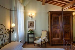 Łóżko lub łóżka w pokoju w obiekcie Hotel Mulino di Firenze - WorldHotels Crafted