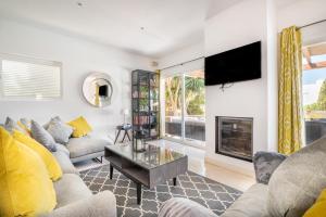 a living room with a couch and a fireplace at Villa Ohana in Cacla D'or