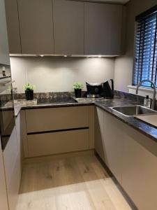 a kitchen with a sink and a counter top at Gleneagles Holiday Home in Auchterarder