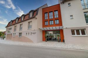 a building on the side of a street at Hotel Kupferzell in Kupferzell