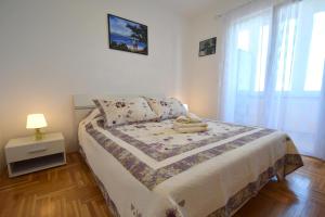Postel nebo postele na pokoji v ubytování Apartment Lucy