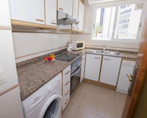 Kuchyň nebo kuchyňský kout v ubytování Edificio La Reina