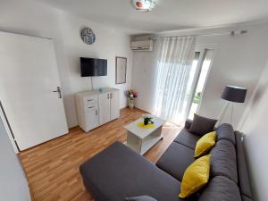 a living room with a couch and a table at Apartments South in Ulcinj