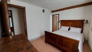 Postel nebo postele na pokoji v ubytování LA CA' DEI COMARI - Locanda da Tullio