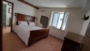 Postel nebo postele na pokoji v ubytování LA CA' DEI COMARI - Locanda da Tullio