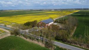 a house with solar panels on it in a field at Oklahoma Home in Ockholm