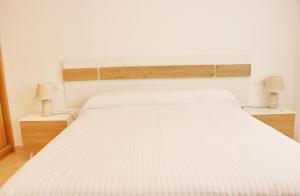 Łóżko lub łóżka w pokoju w obiekcie Apartamento Río Salado