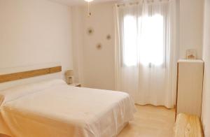 Łóżko lub łóżka w pokoju w obiekcie Apartamento Río Salado