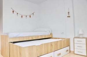 Łóżko lub łóżka w pokoju w obiekcie Apartamento Río Salado