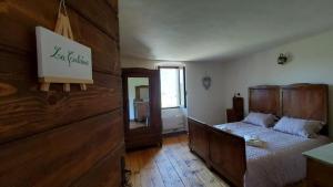Postel nebo postele na pokoji v ubytování LA CA' DEI COMARI - Locanda da Tullio