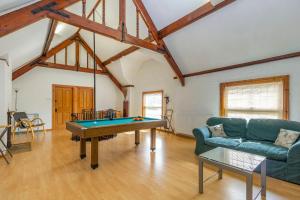a living room with a pool table in it at Southport Coach House in Southport