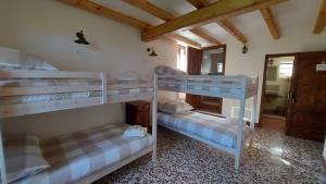 Postel nebo postele na pokoji v ubytování LA CA' DEI COMARI - Locanda da Tullio