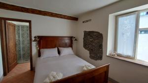 Postel nebo postele na pokoji v ubytování LA CA' DEI COMARI - Locanda da Tullio