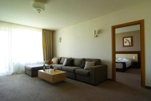 a living room with a couch and a table at Belchin Garden SPA&Wellness in Belchin +67 photos