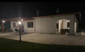 a house with a light in front of it at night at La dolce vita in Scanzano