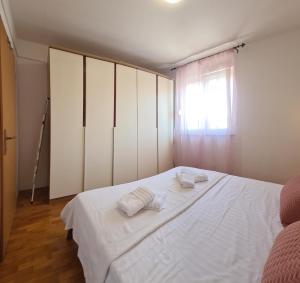 Postel nebo postele na pokoji v ubytování Ciao Zadar