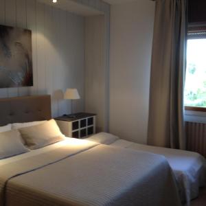 Postel nebo postele na pokoji v ubytování Hotel Valjunco