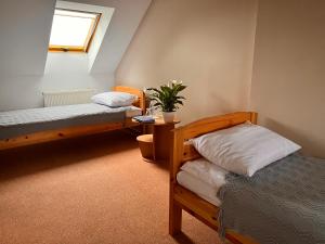 מיטה או מיטות בחדר ב-Hotel Marislav